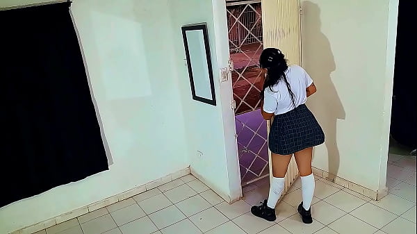 Young student in college uniform gives a blowjob to unknown delivery man